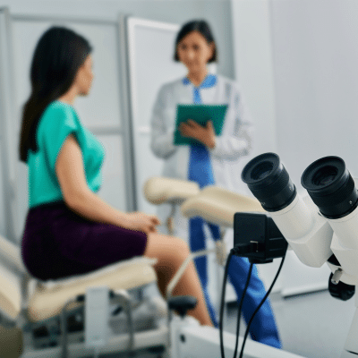 The importance of routine gynecological exams 2 Woman meeting with doctor for her gynecological exam, representing routine gynecological exams